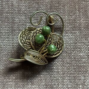 Elegant Gold and Green Brooch